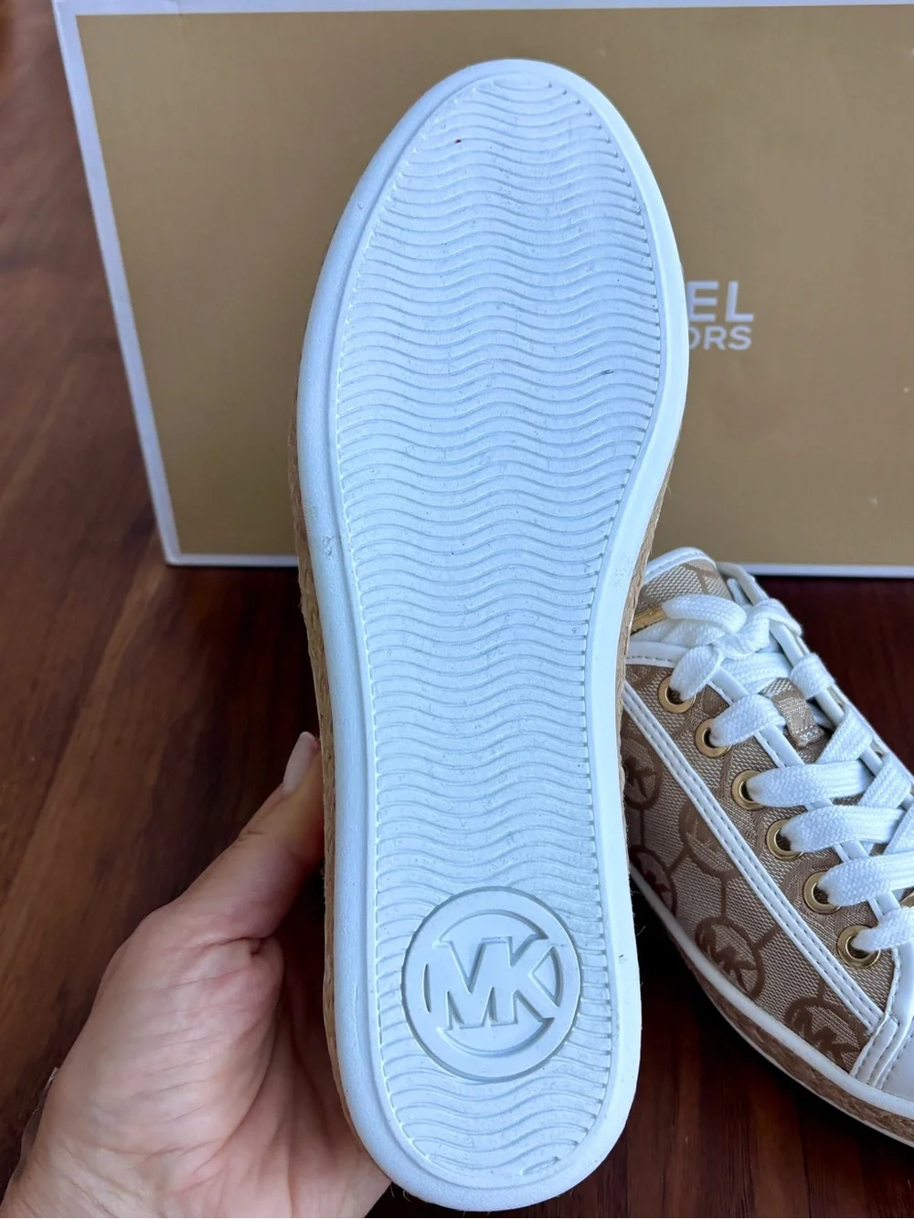 Brand New pair of Michael Kors Kristy Slide Sneakers in a cream and beige, 6.5.
